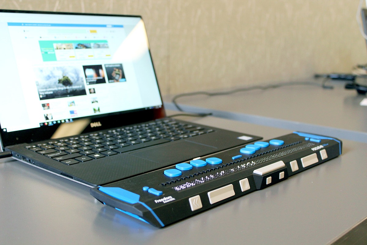 A laptop computer with a refreshable braille display.